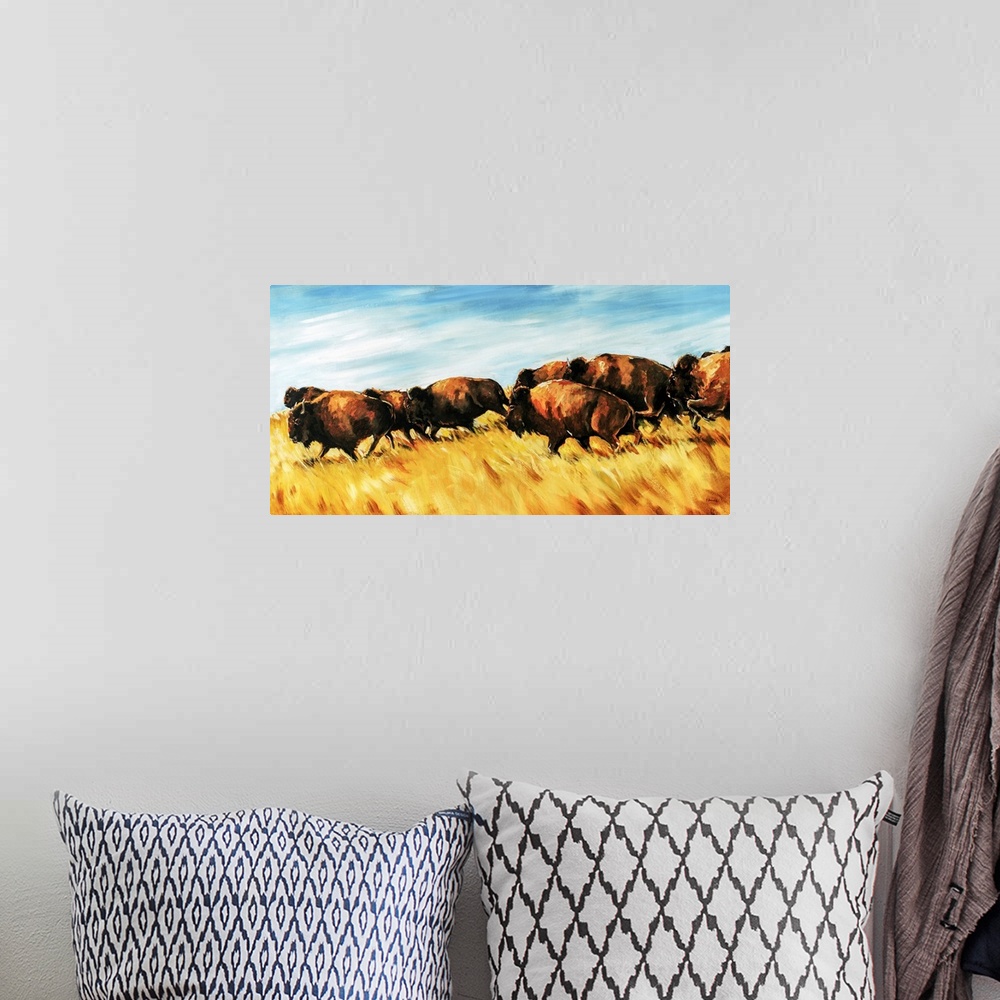 A bohemian room featuring Painting of a herd of buffalo running wild on a grassy plain.
