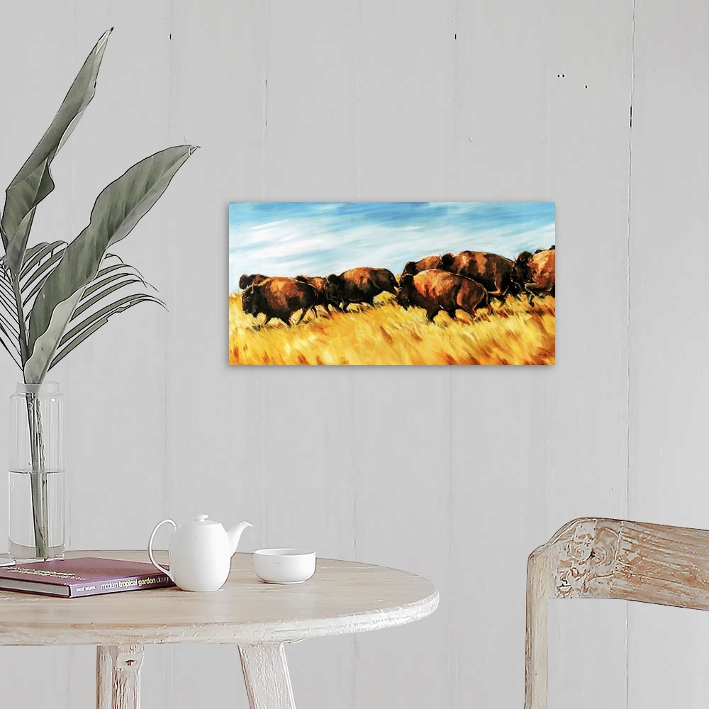 A farmhouse room featuring Painting of a herd of buffalo running wild on a grassy plain.