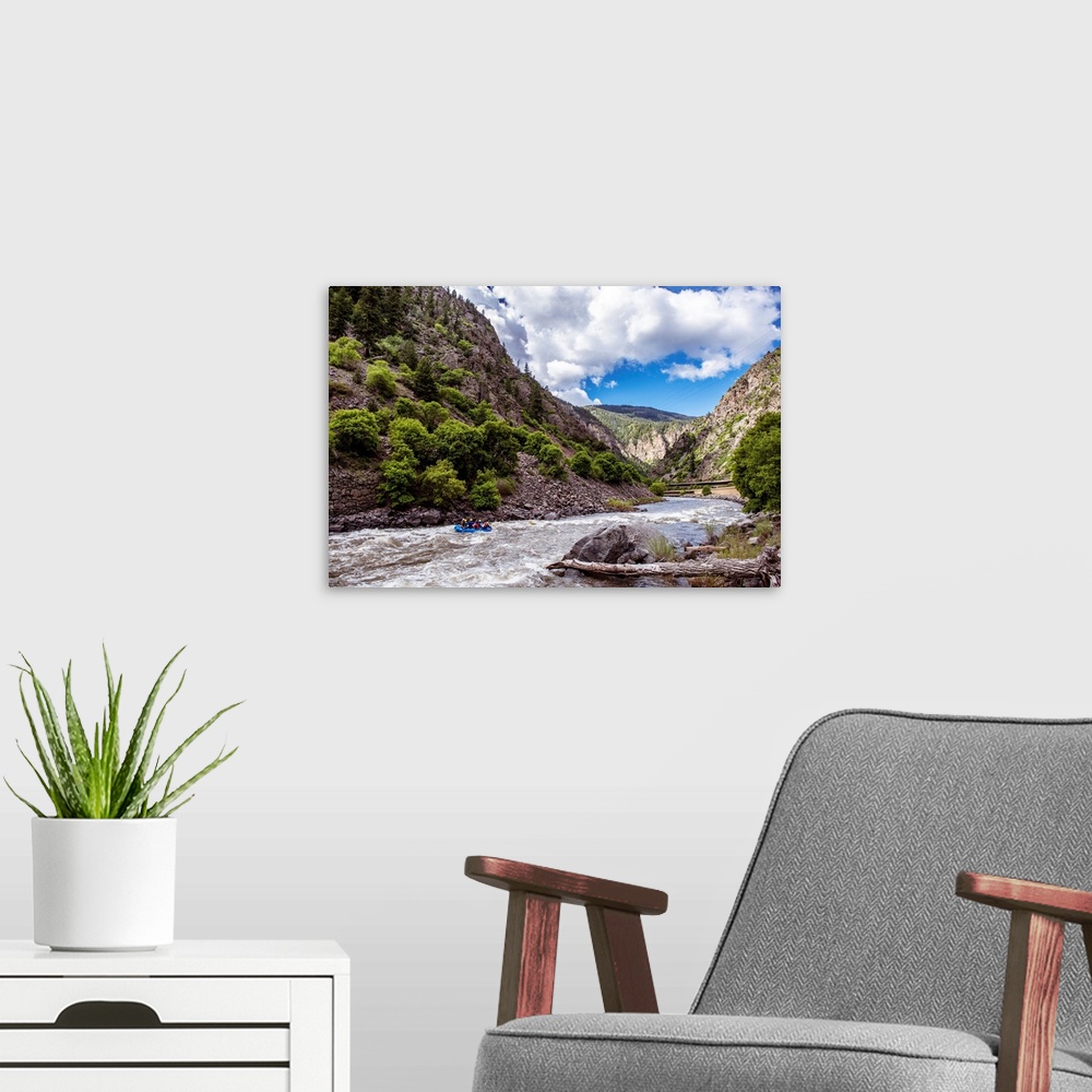 A modern room featuring Photo of a rushing river under a mountain cliffside in Colorado.