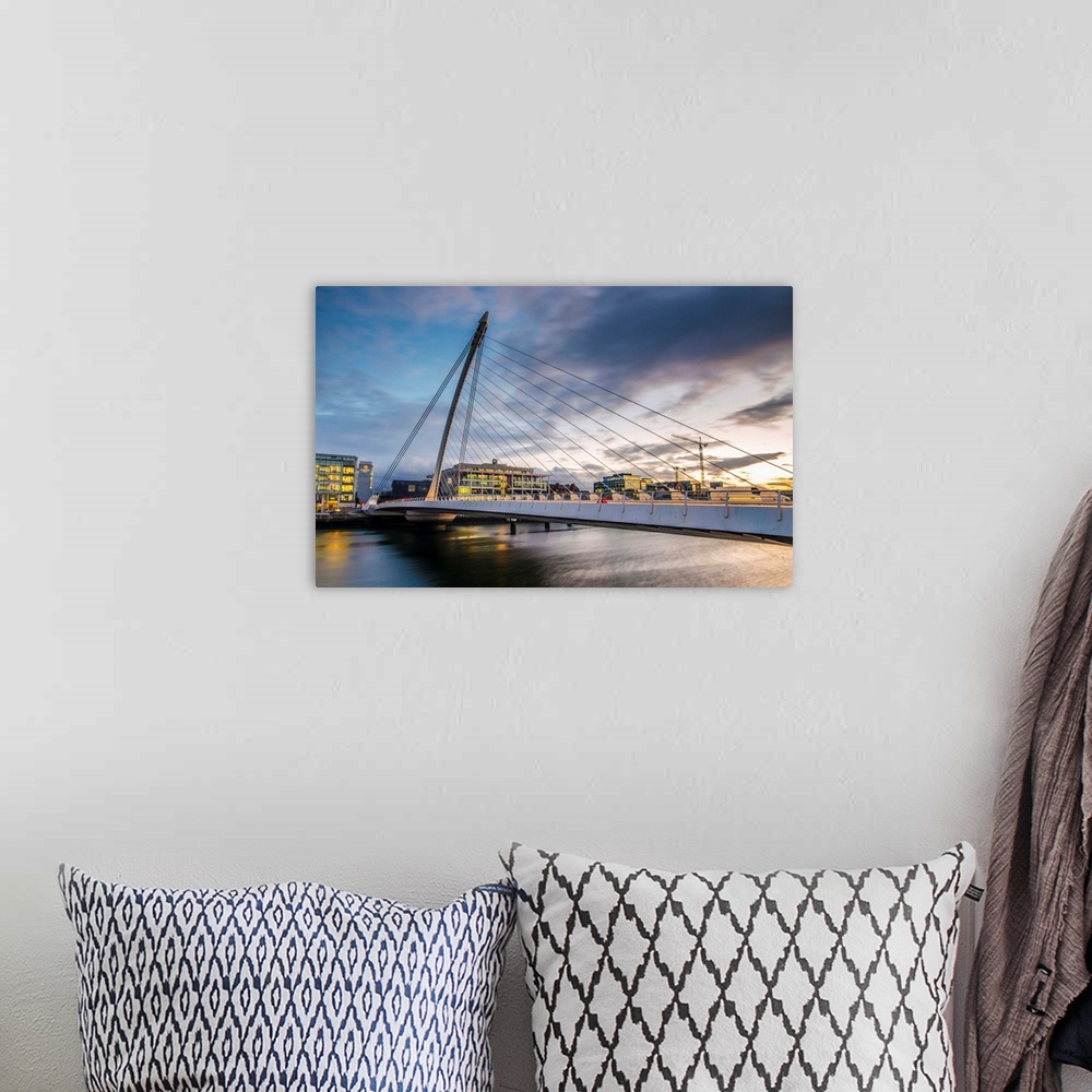 A bohemian room featuring Photograph of the Samuel Beckett Bridge, a cable-stayed bridge in Dublin, Ireland going across th...