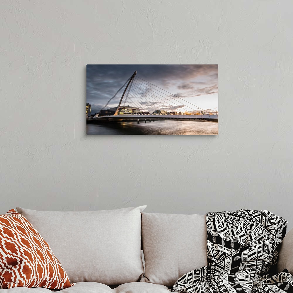 A bohemian room featuring Panoramic photograph of the Samuel Beckett Bridge, a cable-stayed bridge in Dublin, Ireland going...