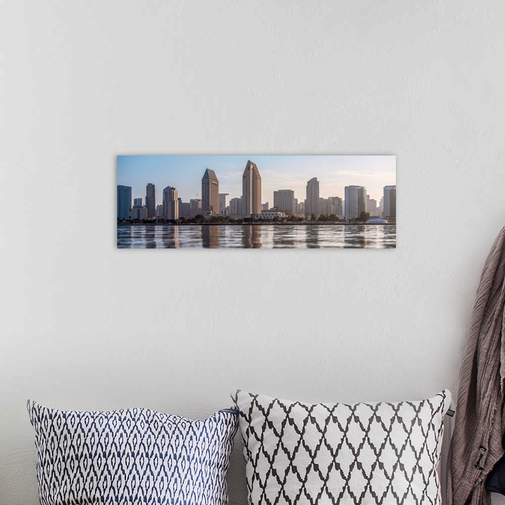 A bohemian room featuring Panoramic photograph of the San Diego, California skyline from the water just before sunset.