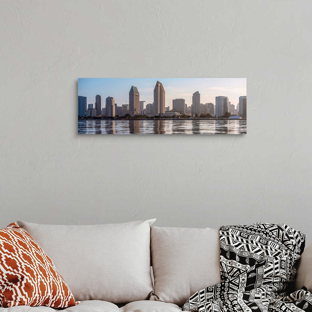 A bohemian room featuring Panoramic photograph of the San Diego, California skyline from the water just before sunset.