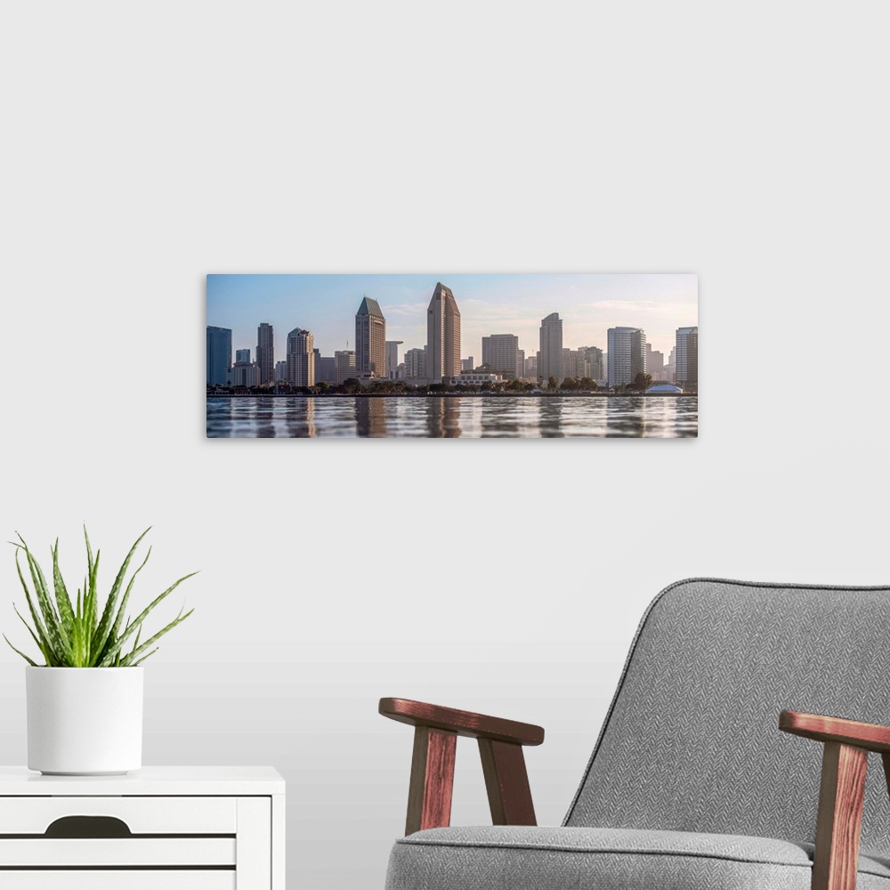 A modern room featuring Panoramic photograph of the San Diego, California skyline from the water just before sunset.