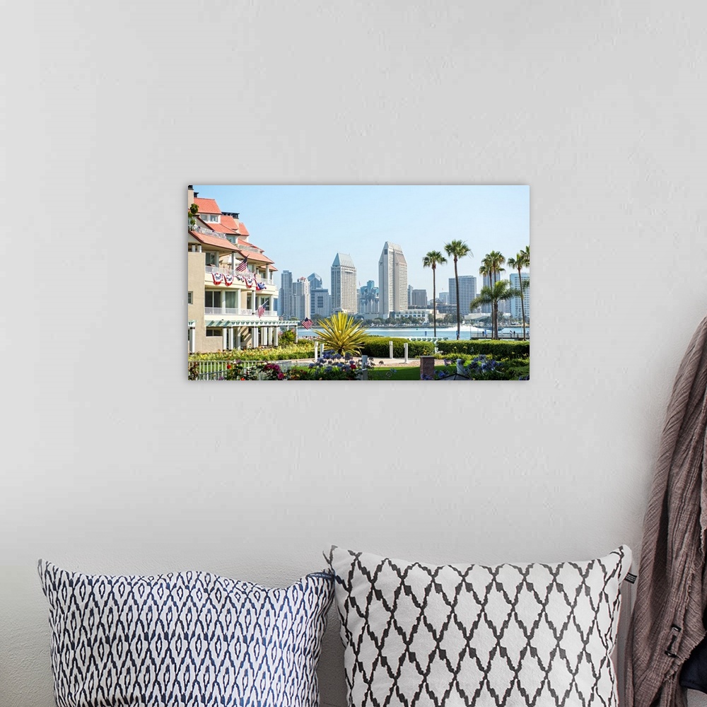 A bohemian room featuring Photograph of part of the San Diego, California skyline with flowers, palm trees, and American fl...