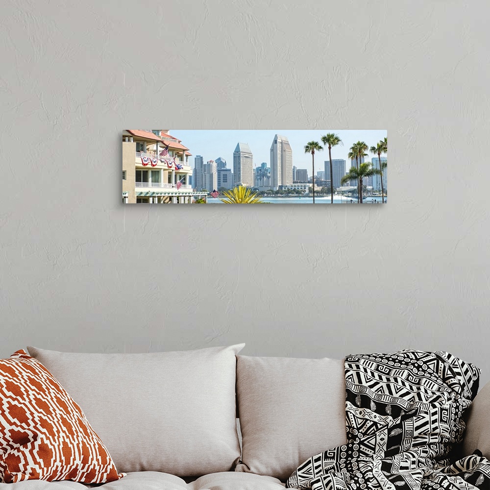 A bohemian room featuring Panoramic photograph of part of the San Diego, California skyline with flowers, palm trees, and A...