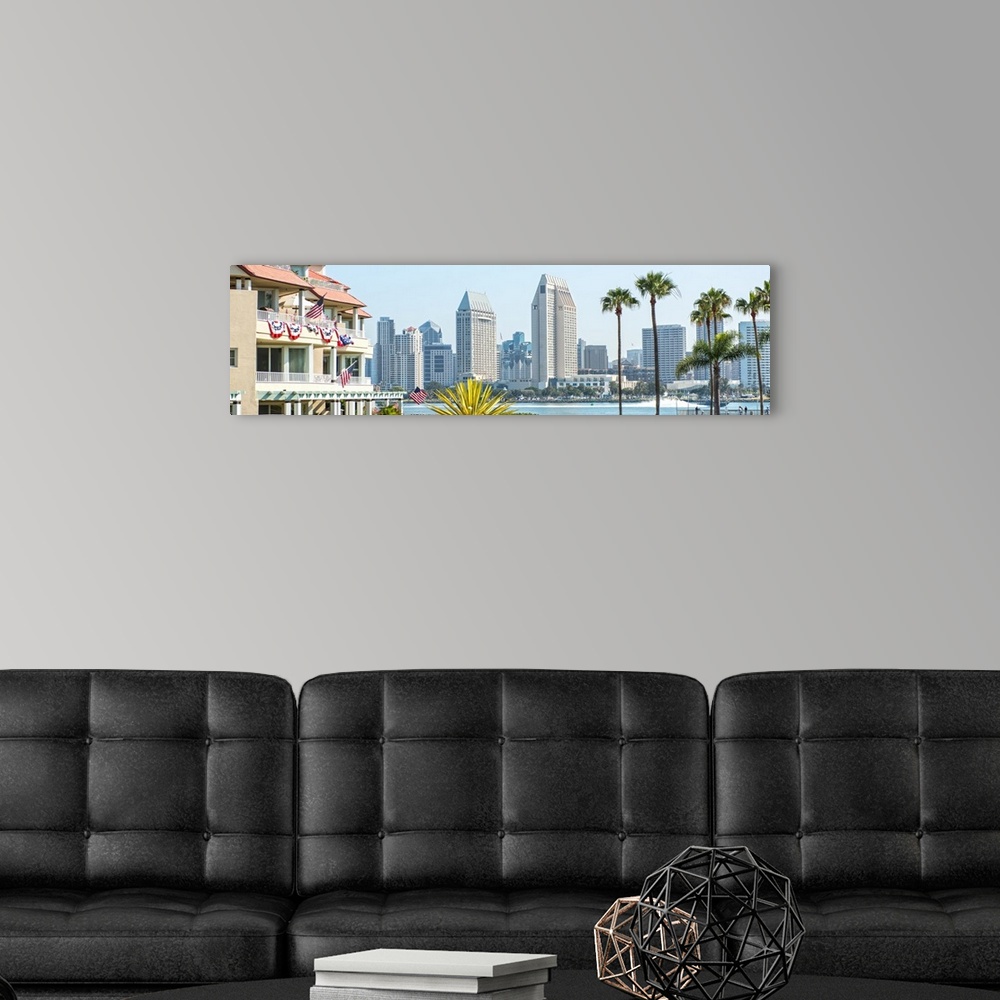 A modern room featuring Panoramic photograph of part of the San Diego, California skyline with flowers, palm trees, and A...