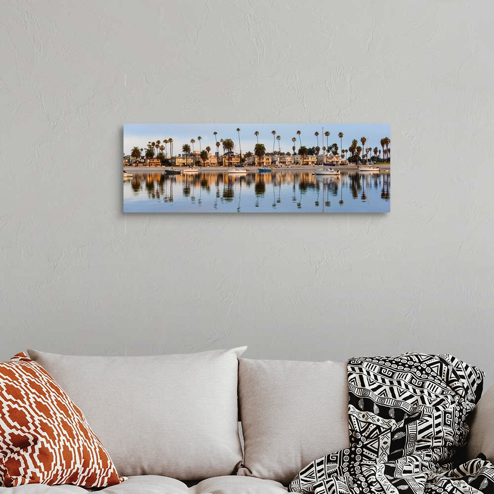 A bohemian room featuring Panoramic photograph of beach houses, palm trees, and boats on the San Diego coast reflecting int...