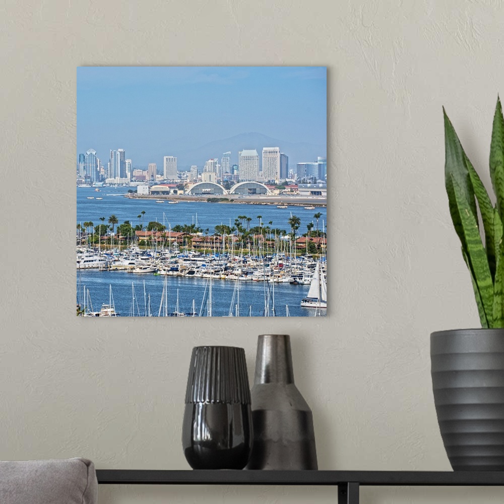 A modern room featuring Square photograph of the San Diego, California skyline with a marina in the foreground packed wit...