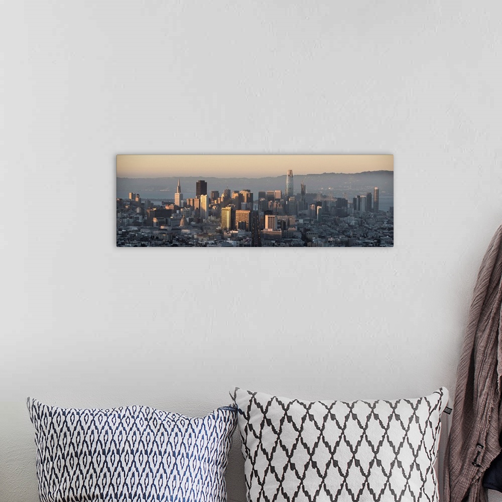 A bohemian room featuring Panoramic photograph of the San Francisco skyline close to sunset.