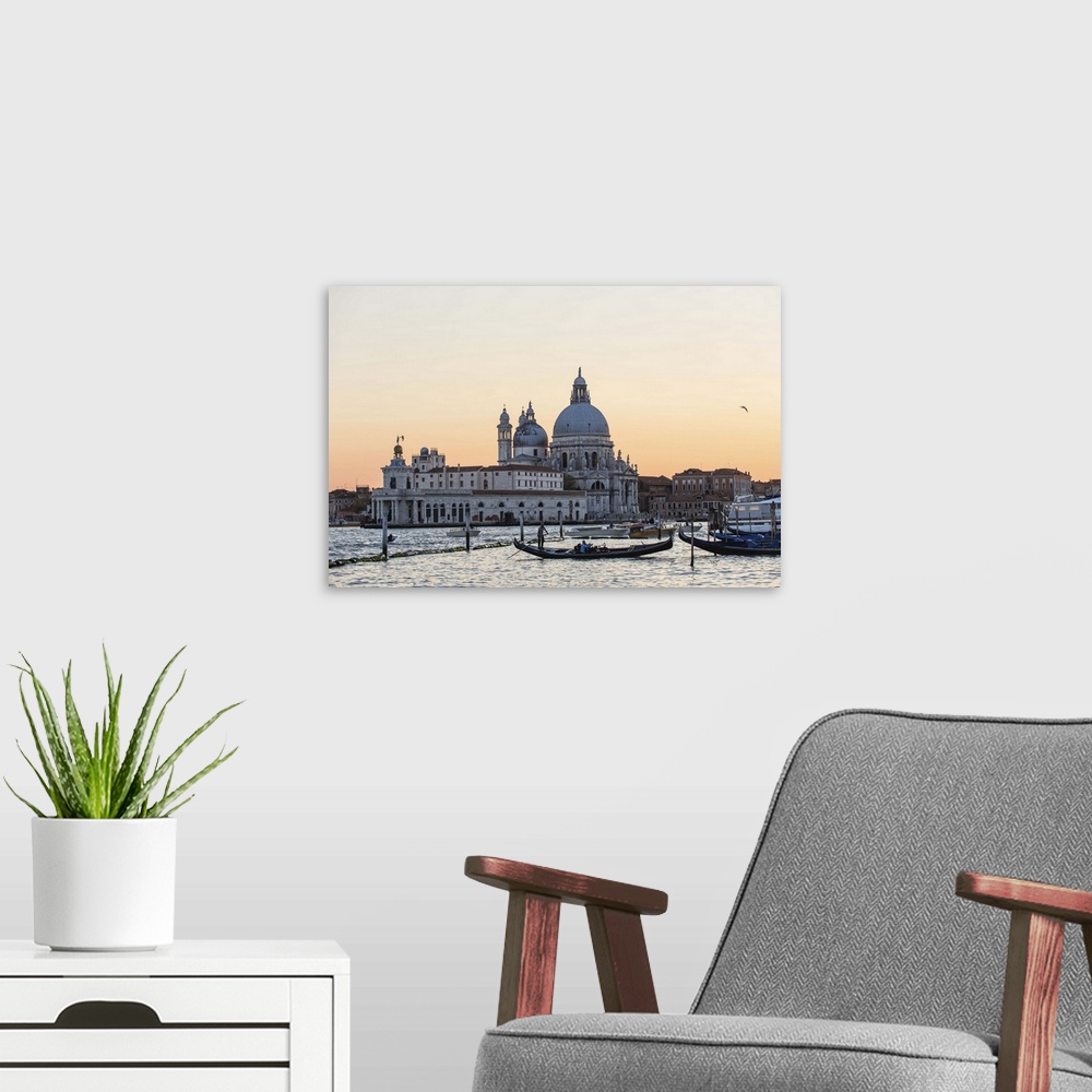 A modern room featuring Photograph of the Santa Maria della Salute (The Salute) from the water at sunset.