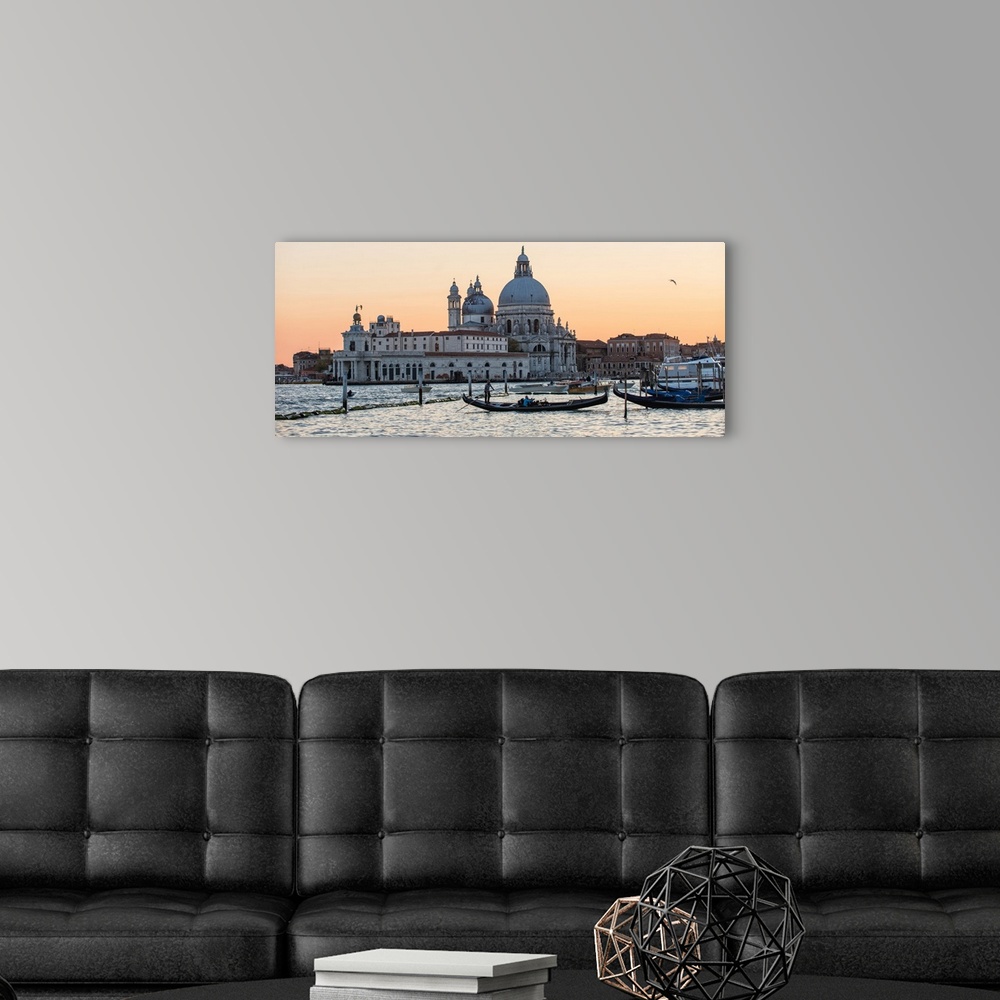 A modern room featuring Panoramic photograph of the Santa Maria della Salute (The Salute) from the water at sunset.