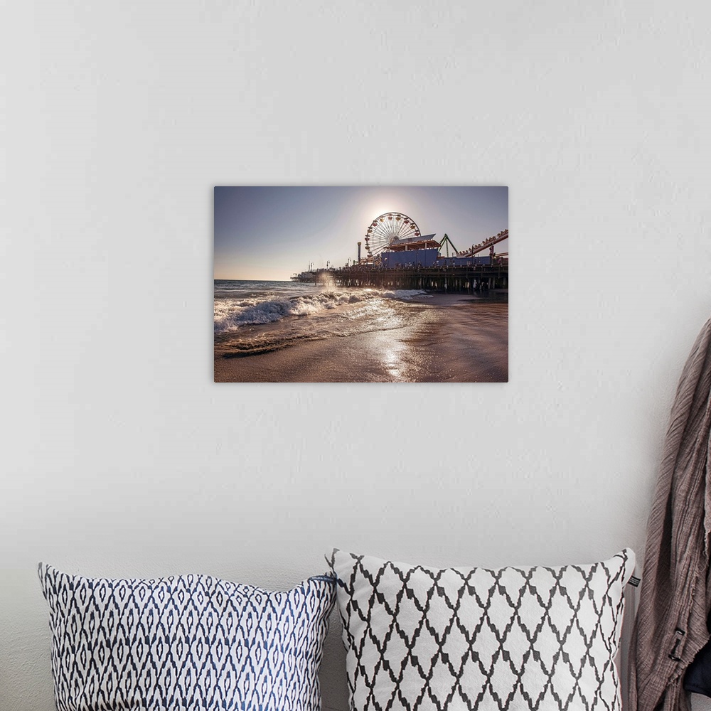 A bohemian room featuring Photograph of the Santa Monica Pier in Los Angeles, California, with the sun setting right behind...