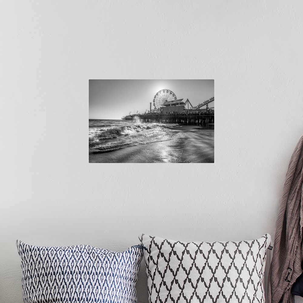 A bohemian room featuring Photograph of the Santa Monica Pier in Los Angeles, California, with the sun setting right behind...
