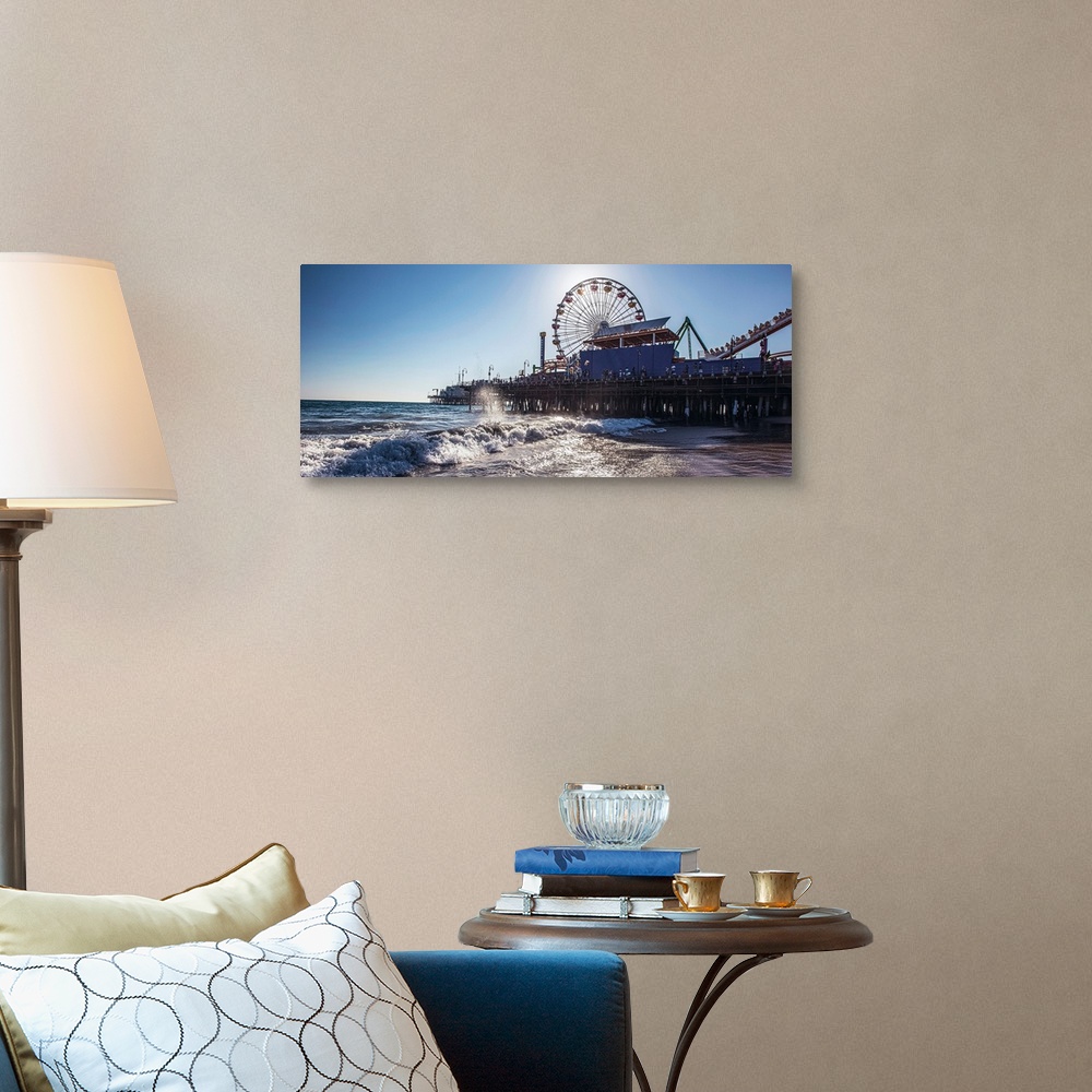 A traditional room featuring Panoramic photograph of the Santa Monica Pier in Los Angeles, California, with the sun setting ri...