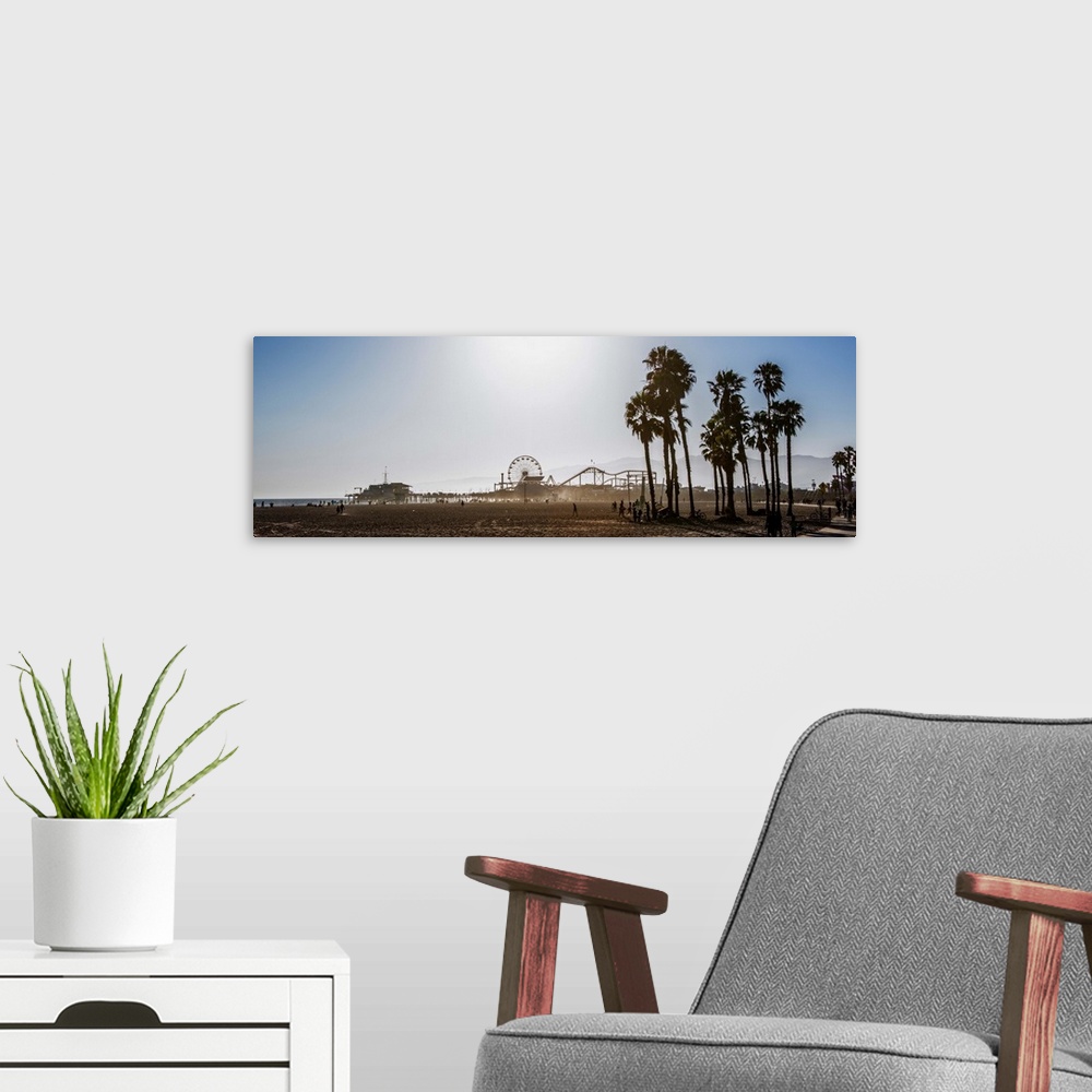 A modern room featuring Panoramic photograph of the Santa Monica Pier in Los Angeles, California, with palm trees in the ...