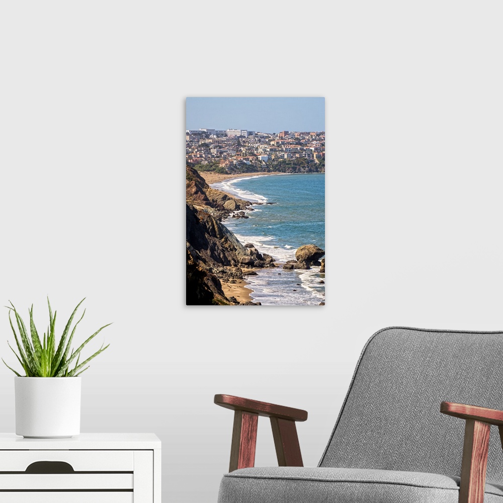 A modern room featuring Landscape photograph of the rocky Pacific coast in Sausalito, California.