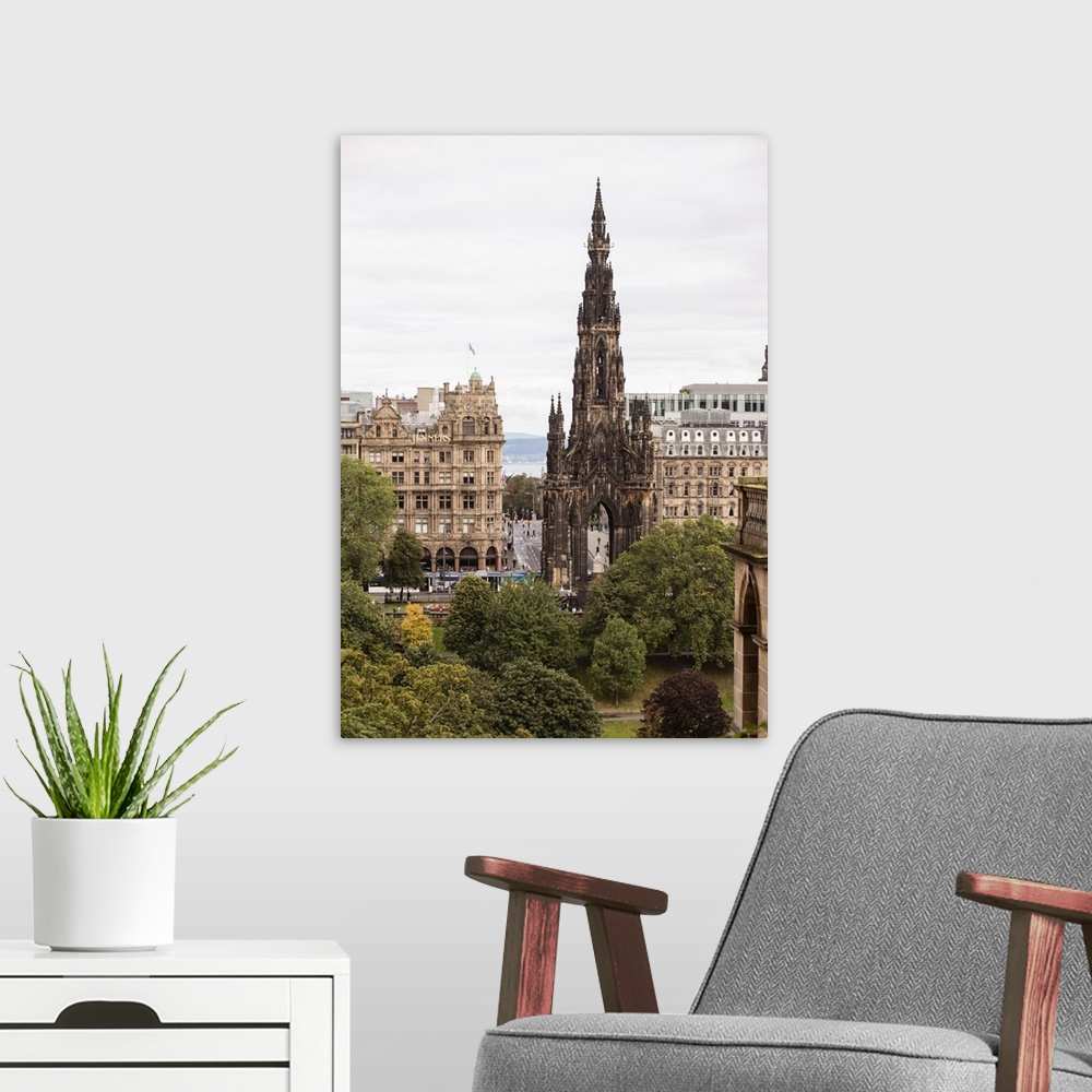 A modern room featuring Photograph of an Edinburgh cityscape highlighting Scott Monument, a Victorian Gothic monument to ...