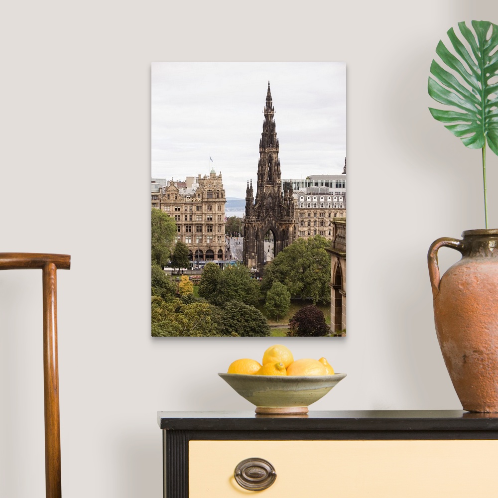 A traditional room featuring Photograph of an Edinburgh cityscape highlighting Scott Monument, a Victorian Gothic monument to ...