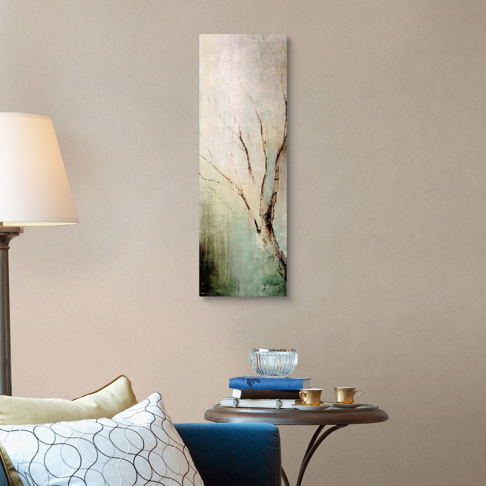A traditional room featuring Panoramic contemporary art depicts a lone tree branch composed of earth tones as it sits in front...