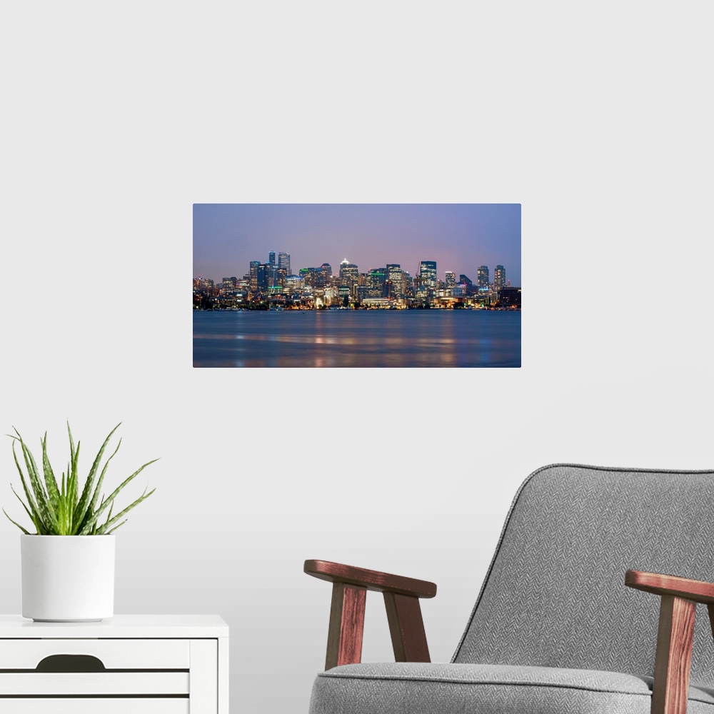 A modern room featuring View of Seattle's city skyline at night, Washington.