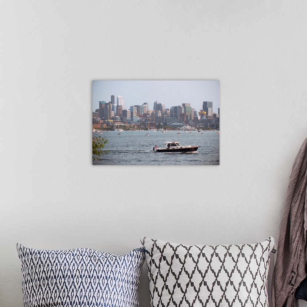 A bohemian room featuring A boat passes by with Seattle's city skyline in the background. View from Lake Union, Washington.