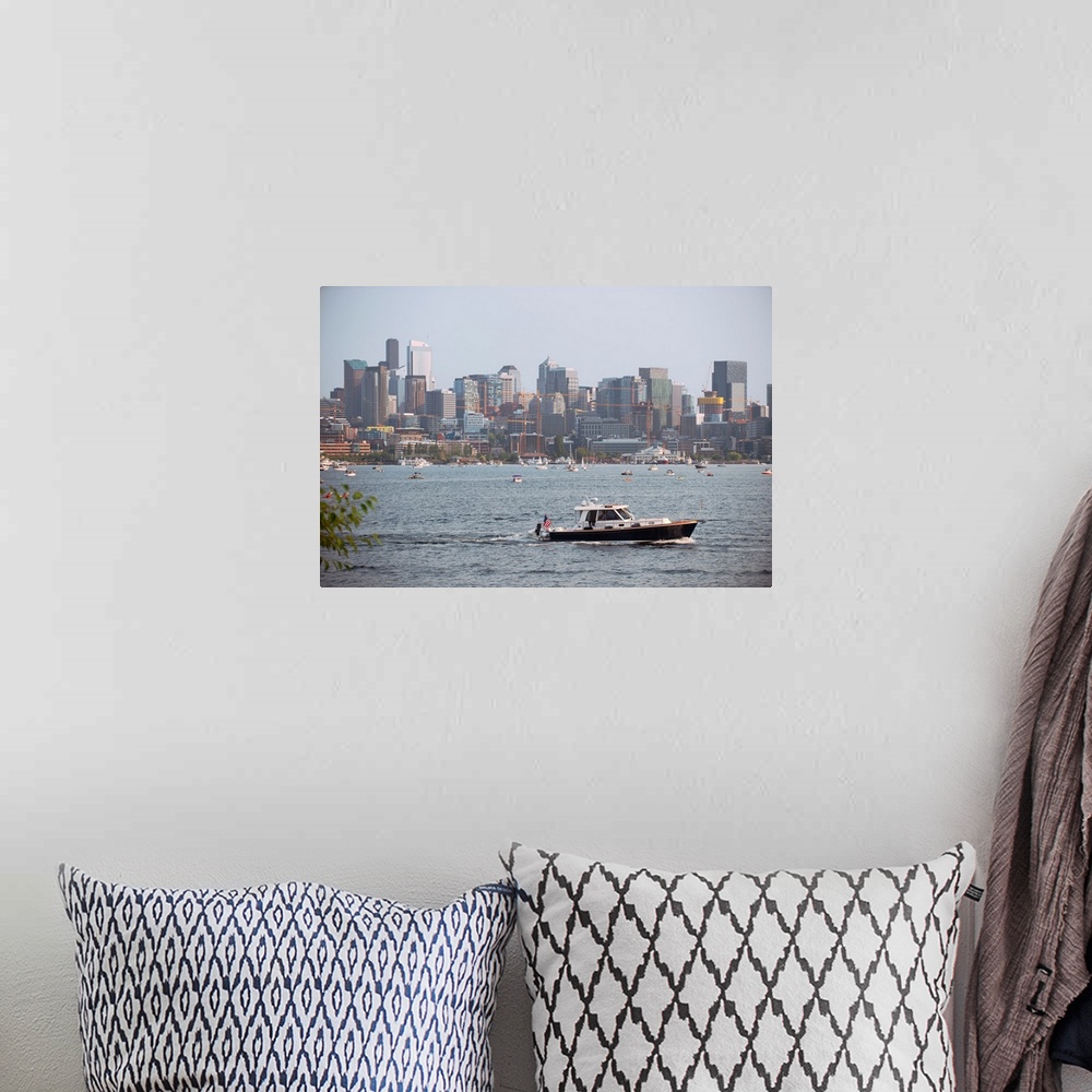 A bohemian room featuring A boat passes by with Seattle's city skyline in the background. View from Lake Union, Washington.