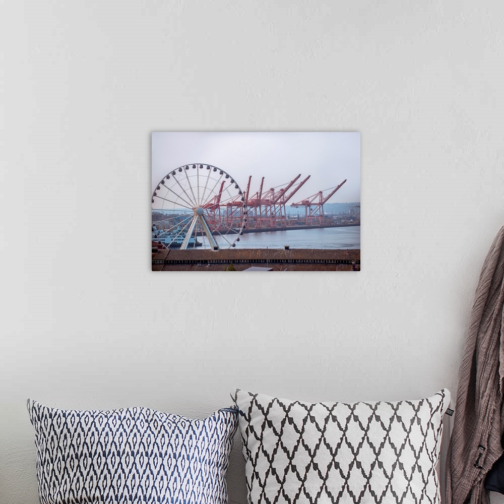 A bohemian room featuring View of Seattle's giant Ferris wheel with dockside cranes in the background in Seattle, Washington.