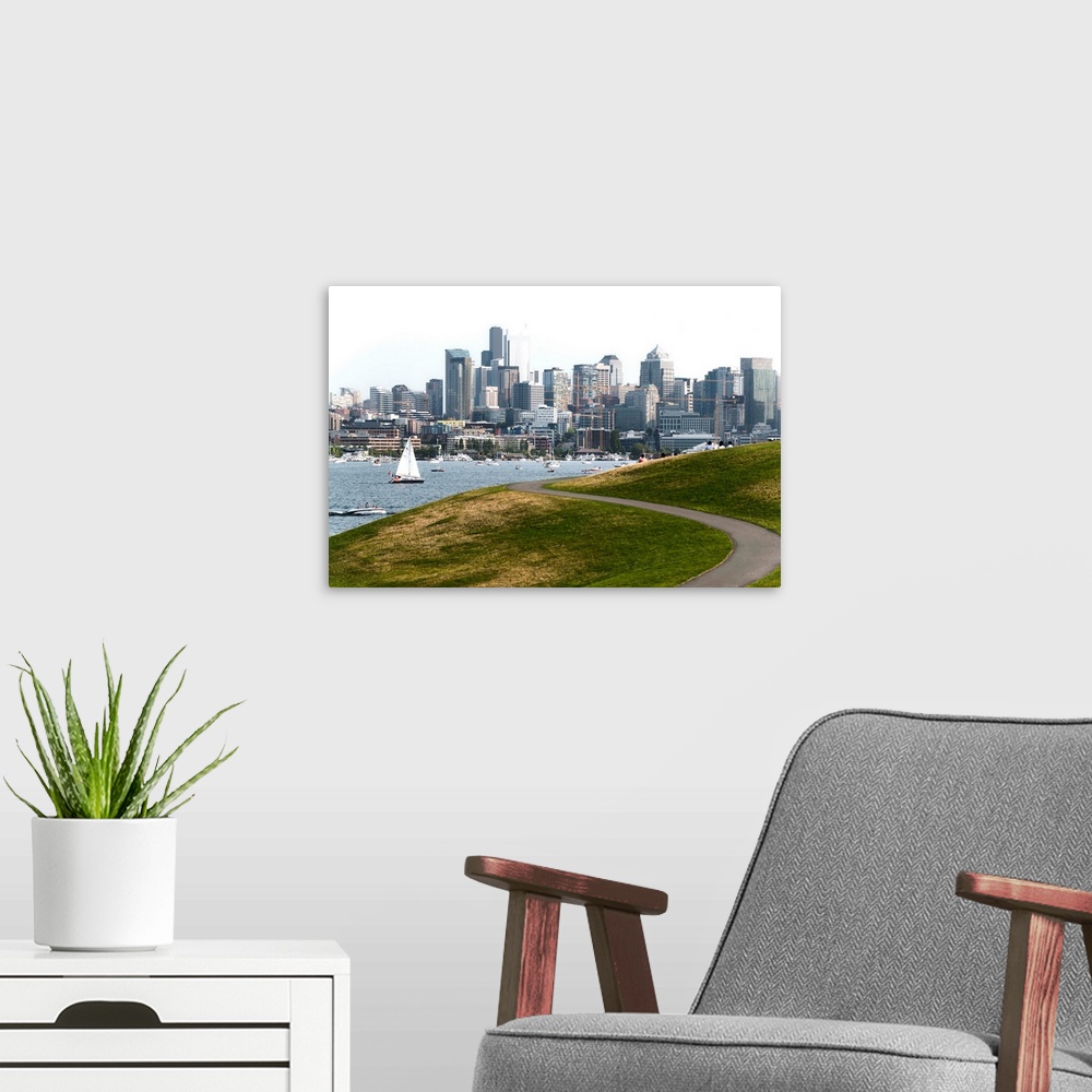 A modern room featuring Photograph of the Seattle skyline with Lake Washington filled with boats in front.