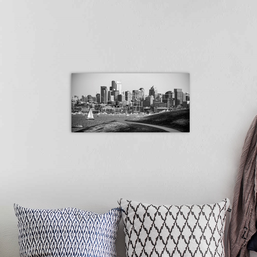 A bohemian room featuring Photograph of the Seattle skyline with Lake Washington filled with boats in front.