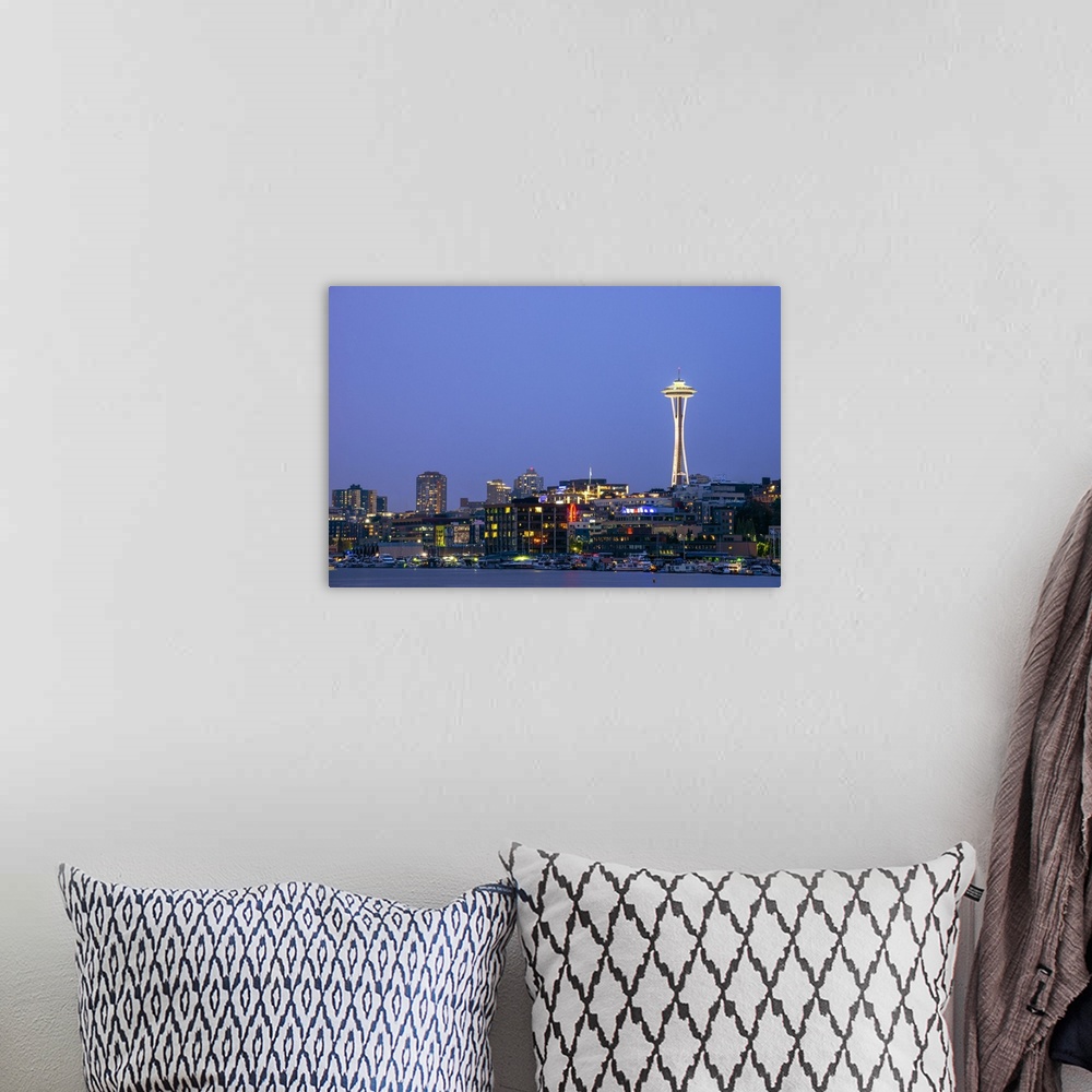 A bohemian room featuring Photograph of the Seattle skyline lit up at night from the water.