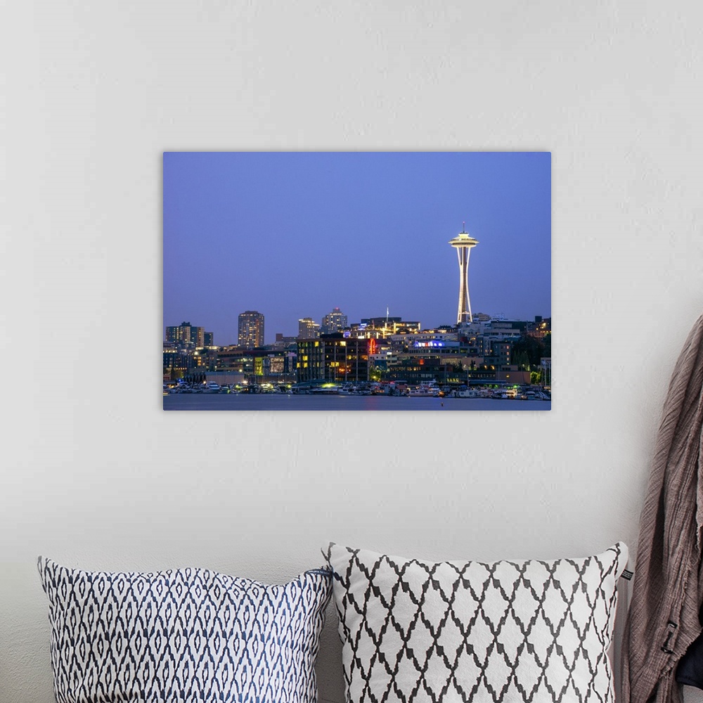 A bohemian room featuring Photograph of the Seattle skyline lit up at night from the water.