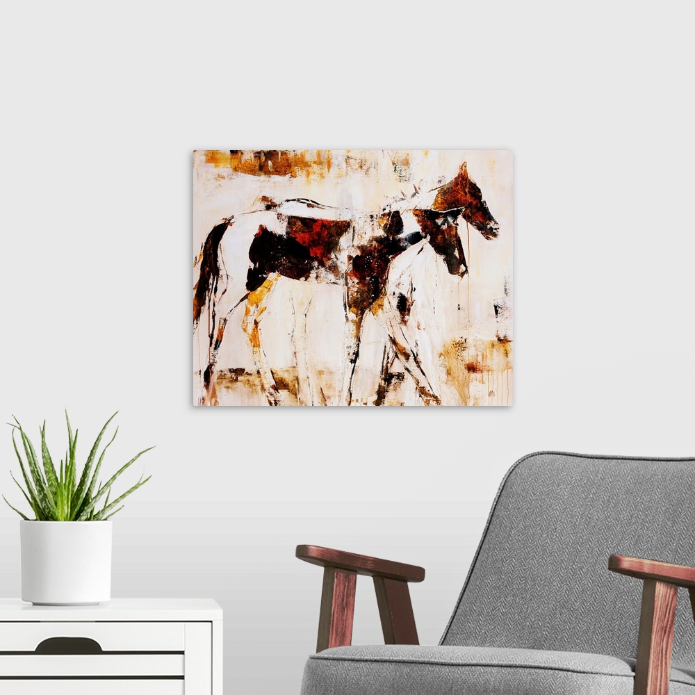 A modern room featuring Earth-toned portrait of two horsed standing side by side.