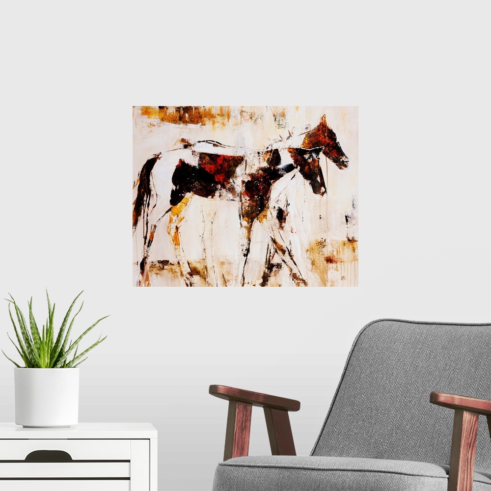 A modern room featuring Earth-toned portrait of two horsed standing side by side.