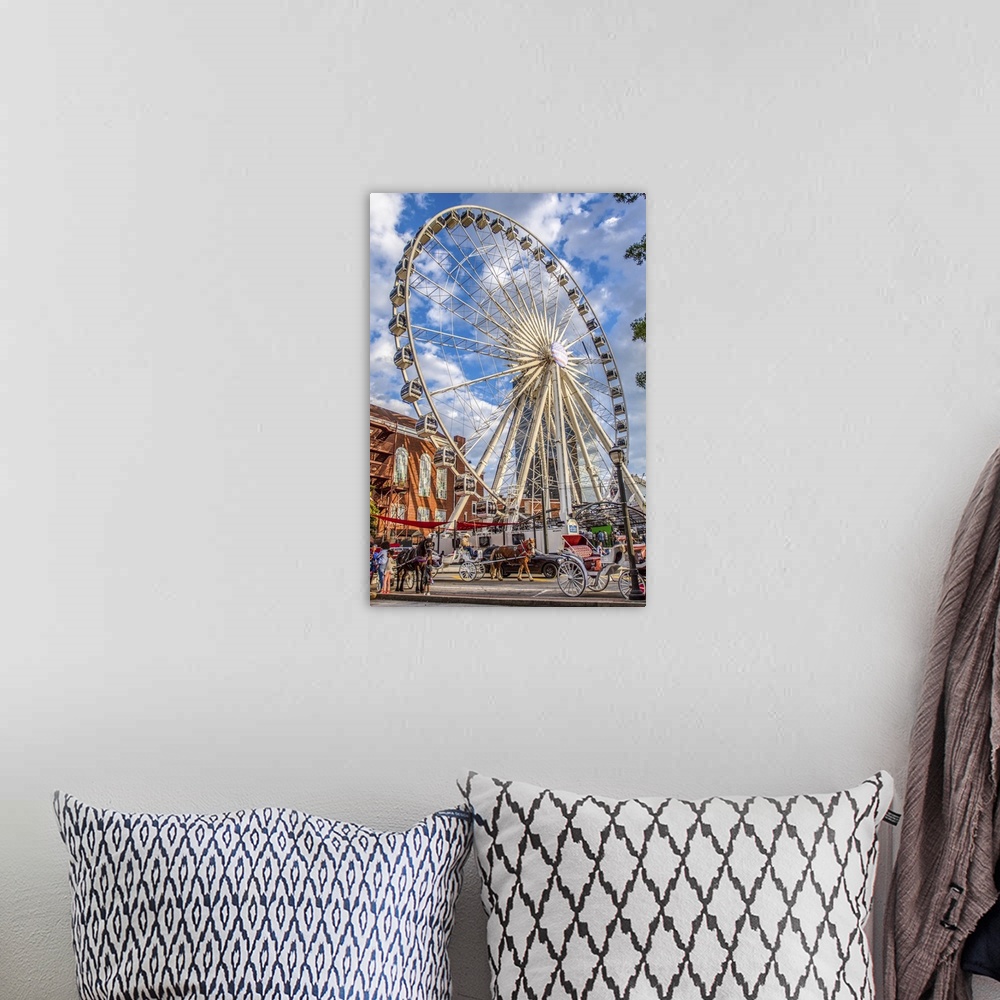 A bohemian room featuring SkyView Atlanta Ferris Wheel, a 20-story wheel, seen over other  recreational attractions in Cent...