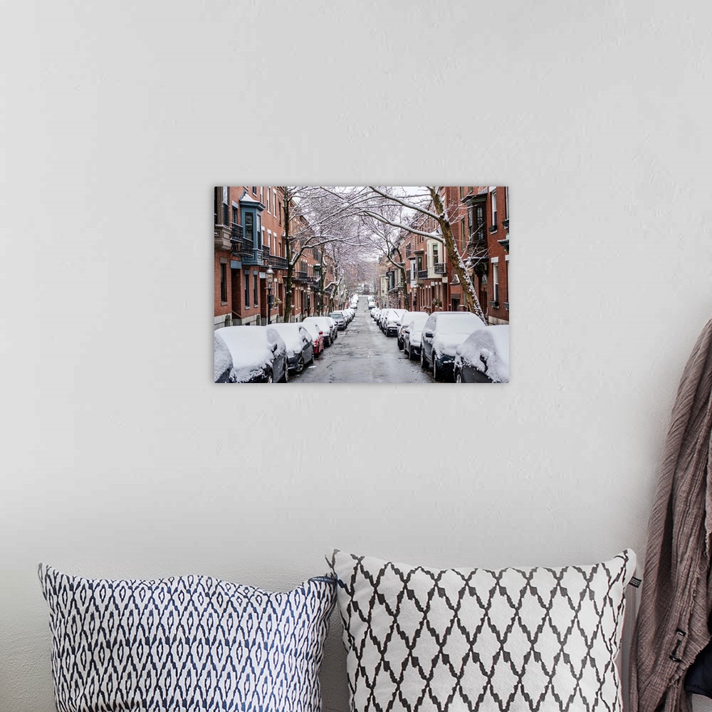 A bohemian room featuring View of snow covered cars parked on street in Boston, Massachusetts.