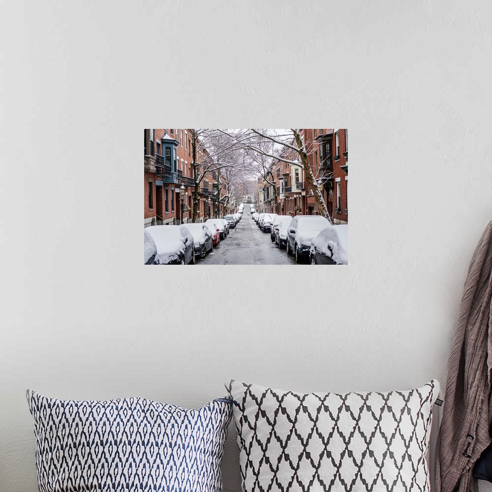 A bohemian room featuring View of snow covered cars parked on street in Boston, Massachusetts.