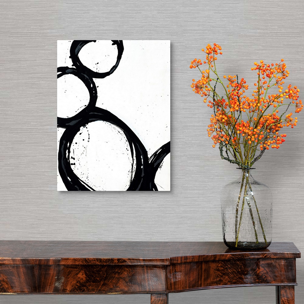 A traditional room featuring Large abstract art includes four circles with thick borders as they sit against and on top of eac...