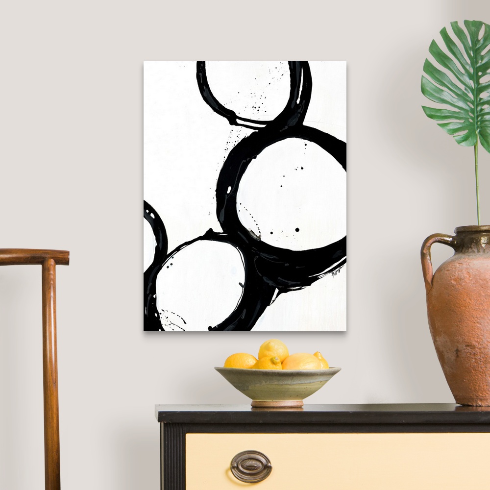 A traditional room featuring Giant monochromatic abstract art includes a set of four uneven and irregular circles positioned n...