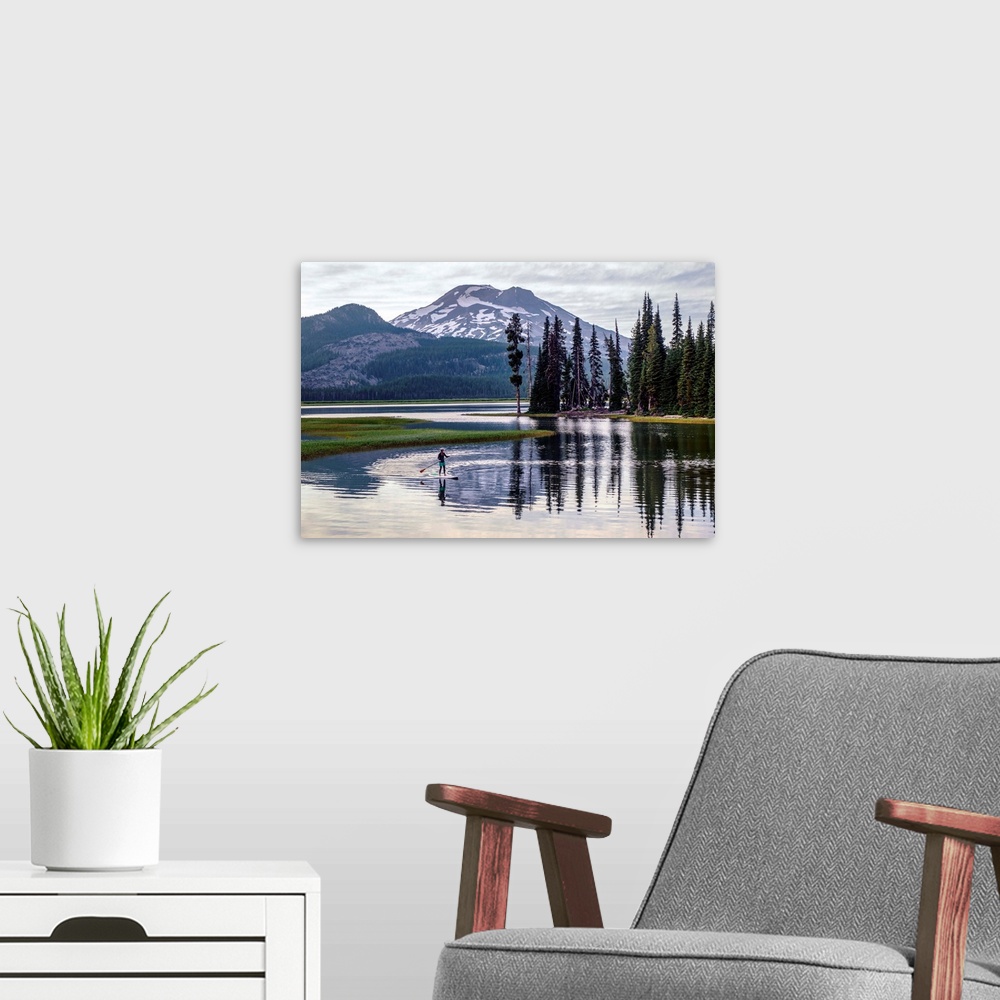 A modern room featuring View of a paddle board surfer at Sparks Lake with South Sister peak in the background, Deschutes ...