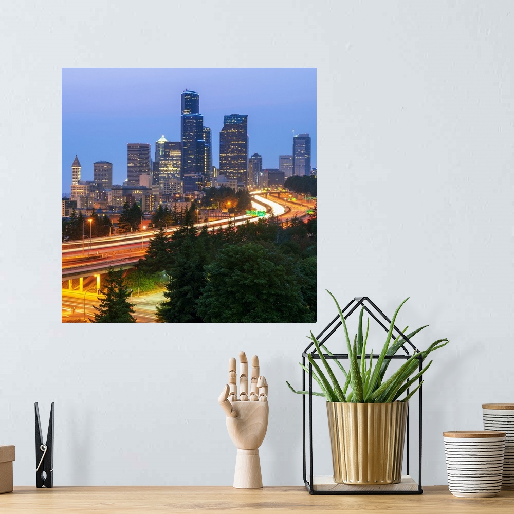 A bohemian room featuring Square photograph of part of the Seattle, WA skyline with light trails from cars on the highway.