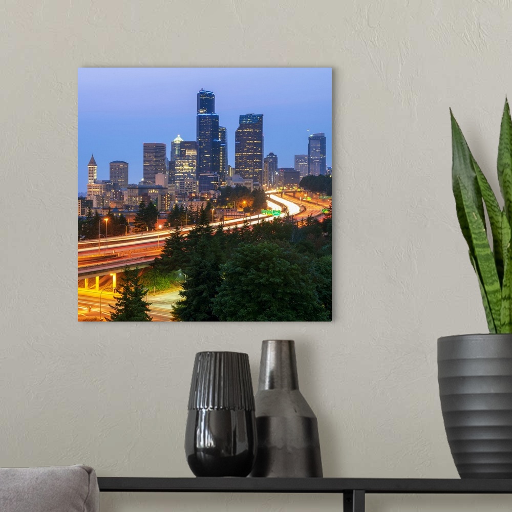 A modern room featuring Square photograph of part of the Seattle, WA skyline with light trails from cars on the highway.