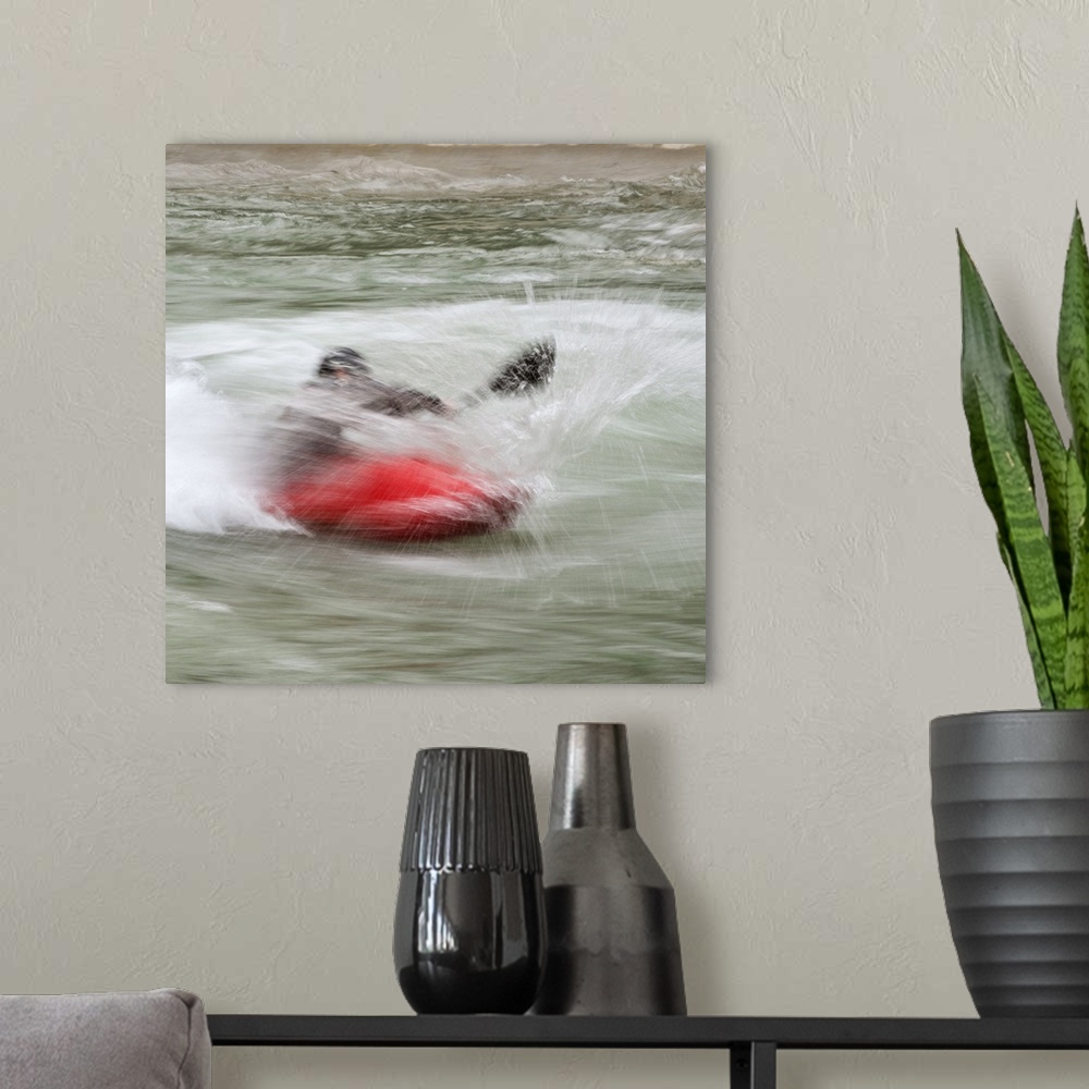 A modern room featuring A person paddling in a kayak in whitewater rapids.