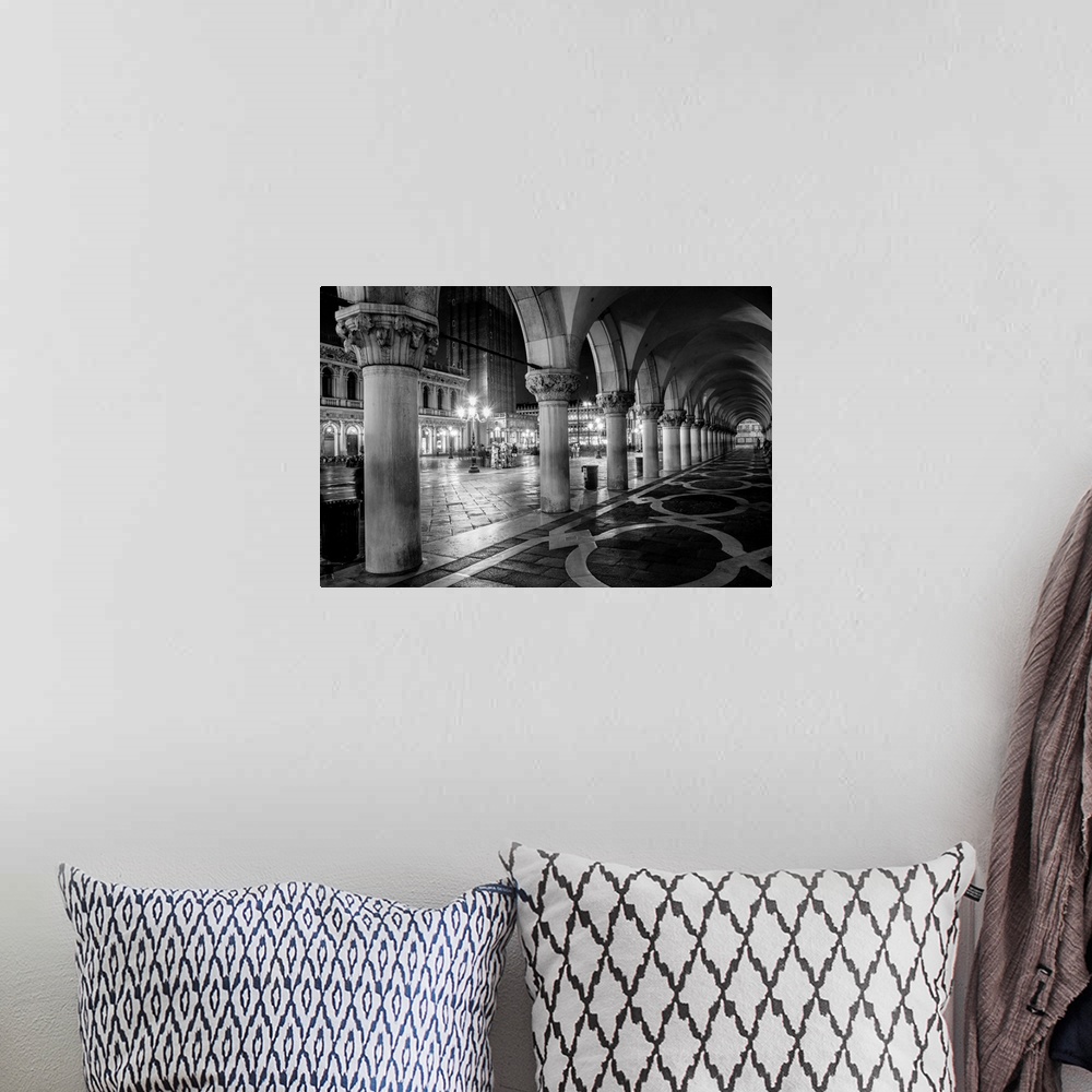 A bohemian room featuring Photograph of the view from underneath arches at night in St. Mark's Square, Venice.