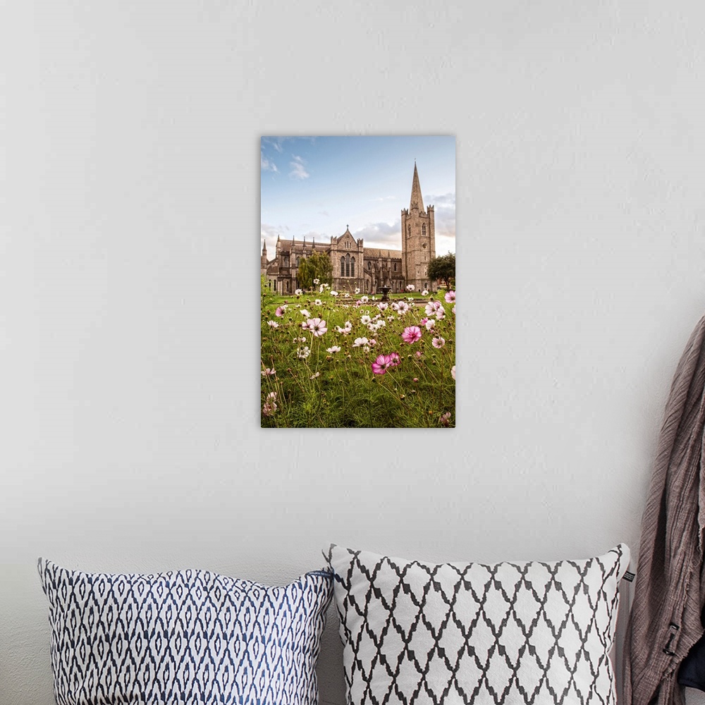 A bohemian room featuring Photograph of St Patrick's Cathedral in Dublin, Ireland, with a field of pink and white wildflowe...