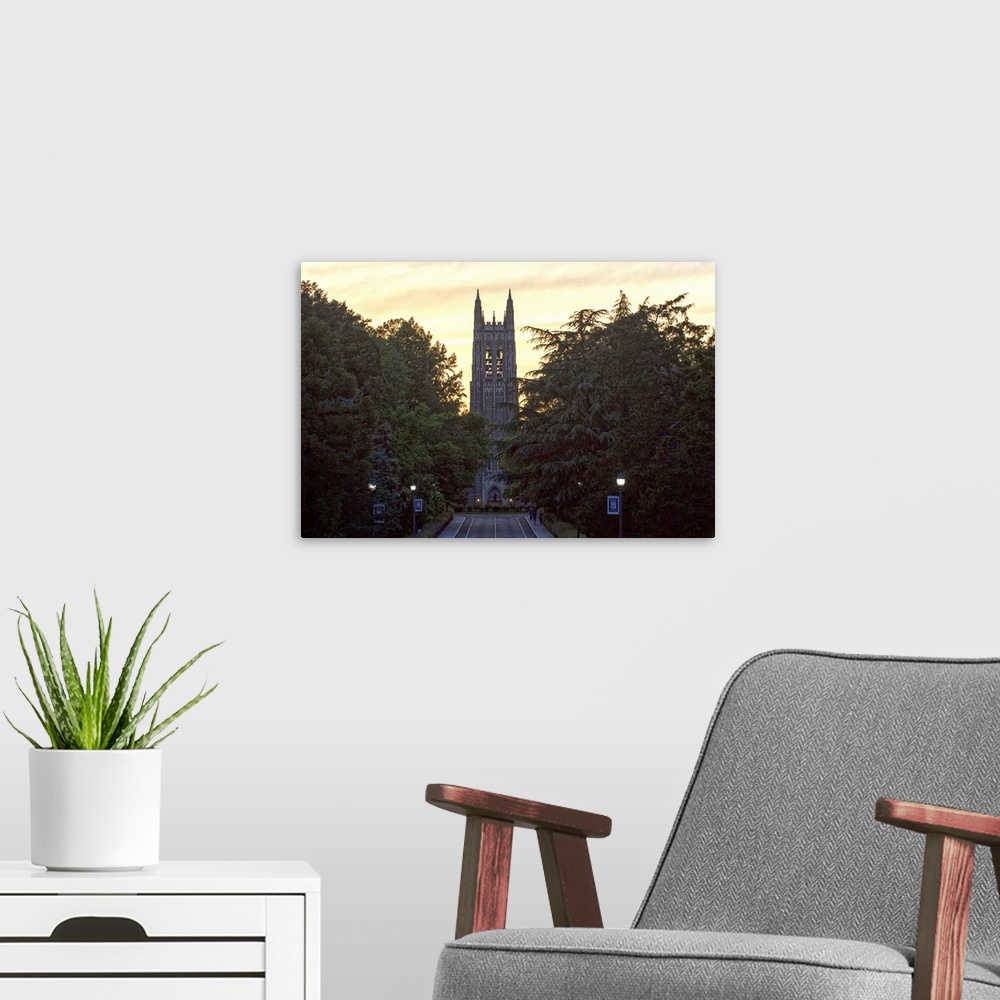 A modern room featuring Road leading to the silhouetted steeple of Duke Chapel, Duke University, Durham, North Carolina.