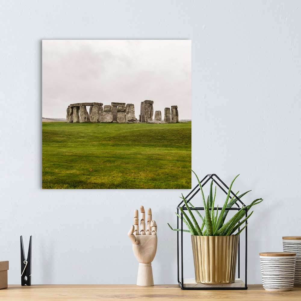 A bohemian room featuring Square photograph of Stonehenge, a prehistoric monument and now a historic landmark in Wiltshire,...