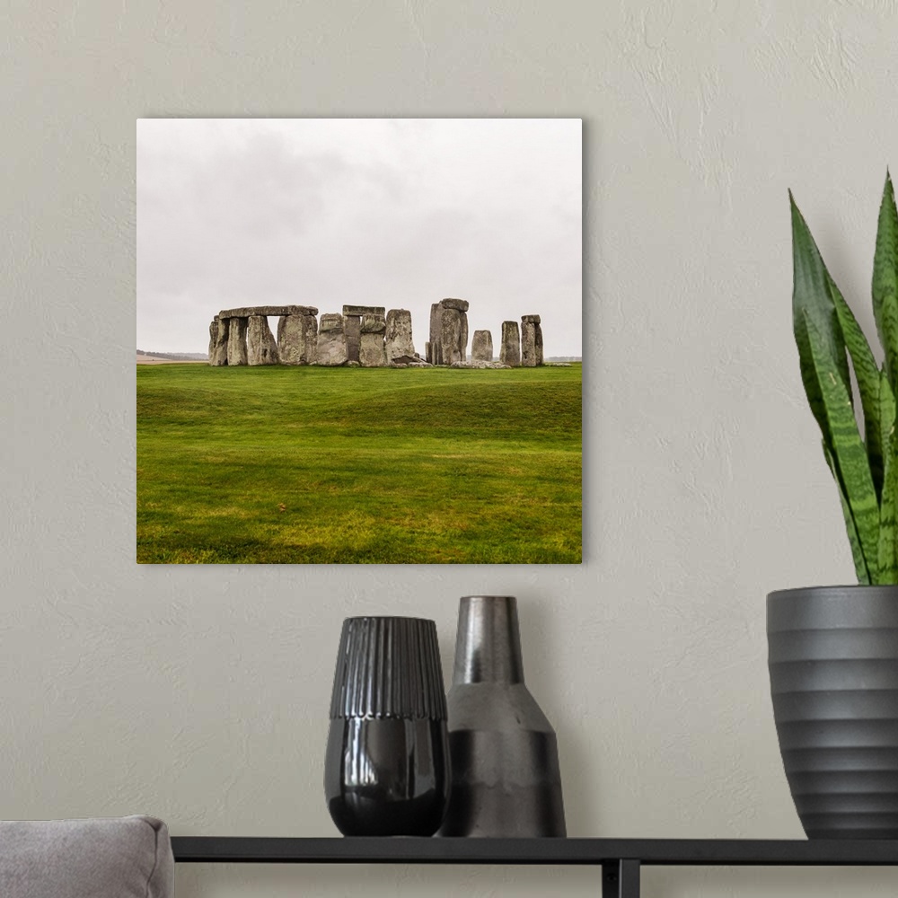 A modern room featuring Square photograph of Stonehenge, a prehistoric monument and now a historic landmark in Wiltshire,...