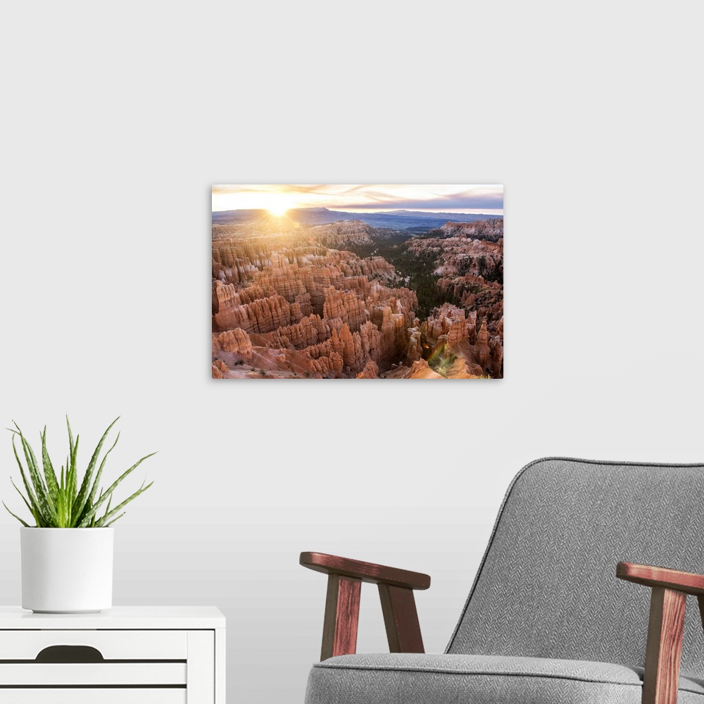 A modern room featuring The sun on the horizon, seen from Bryce Canyon Amphitheater in Bryce Canyon National Park, Utah.