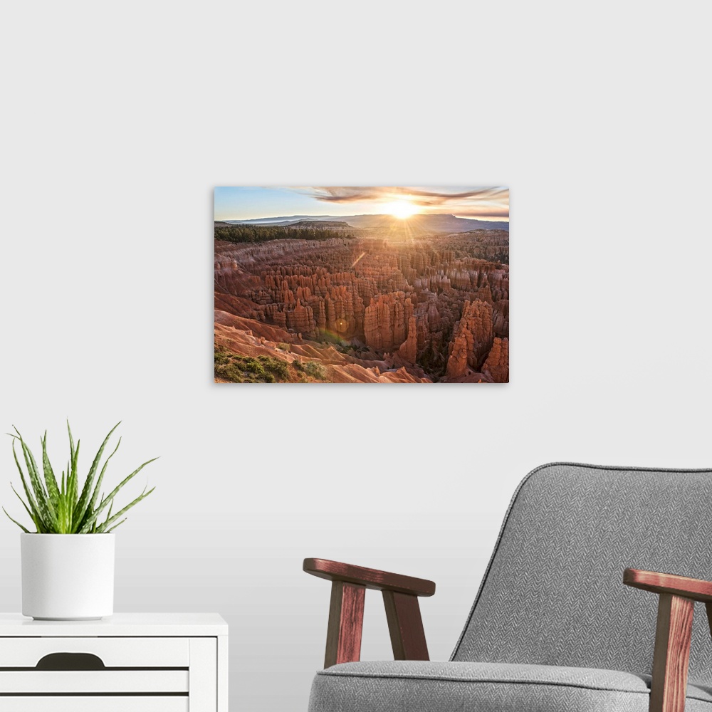A modern room featuring The sun on the horizon, seen from Bryce Canyon Amphitheater in Bryce Canyon National Park, Utah.